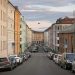 A street with the old houses and the parked cars in the Grünerløkka district of Oslo, Norway, August 2019